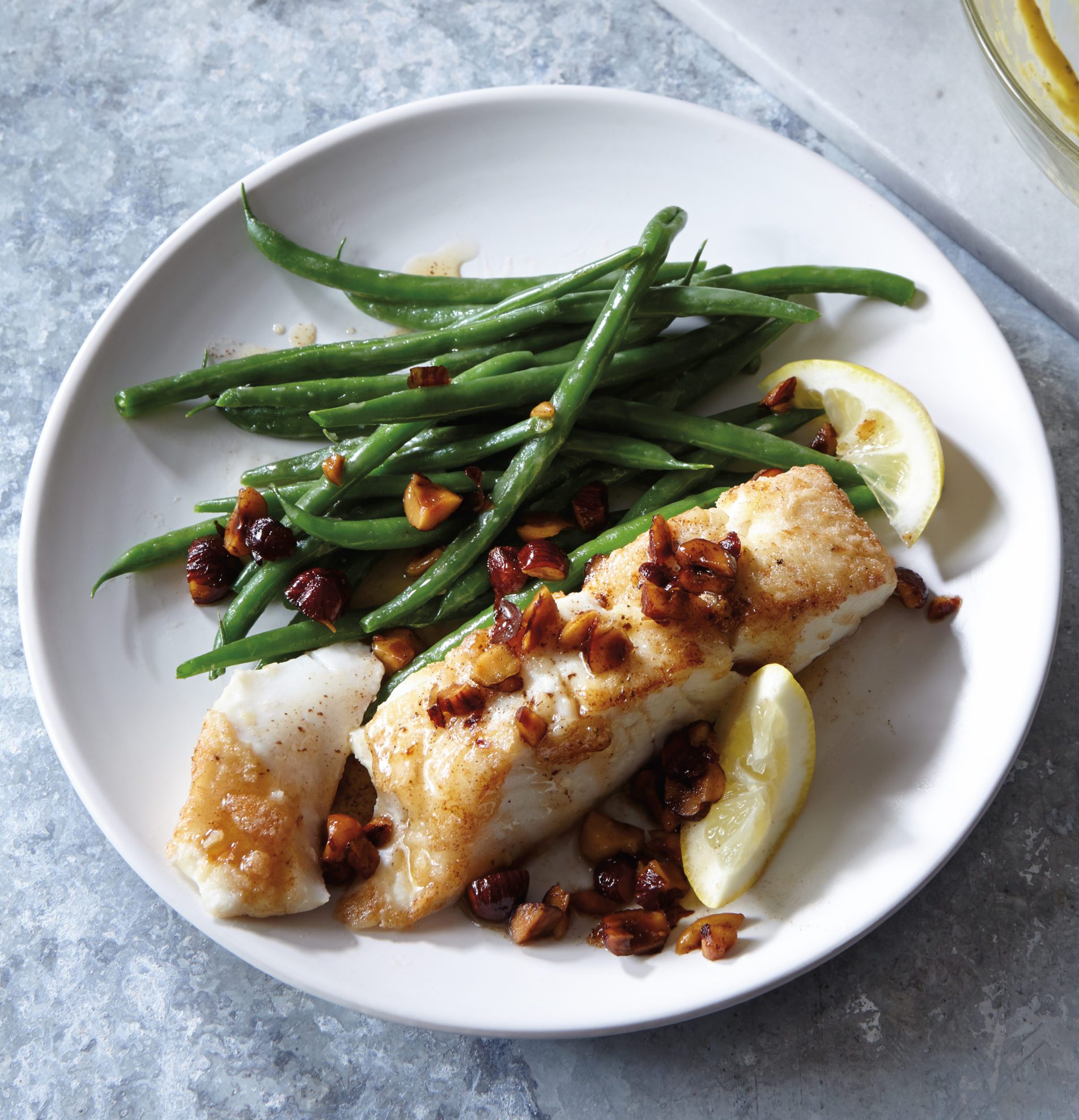 gluten free panseared halibut with brown butter sauce and hazelnuts