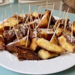 Gluten-free brioche French toast bites with toothpicks for fork-free eating